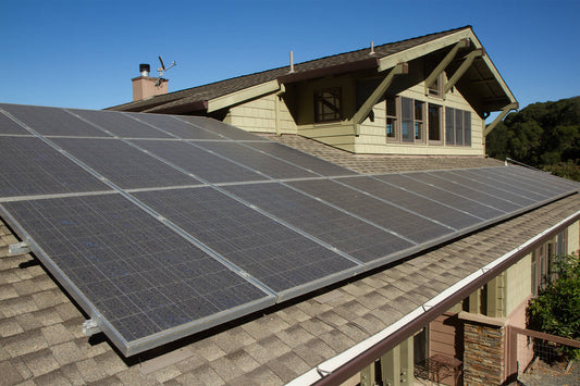 A dated home’s roof covered in solar panels
