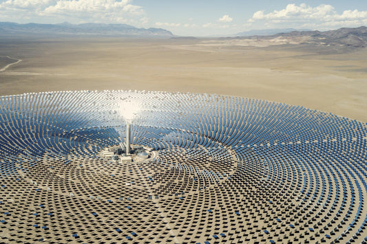 A concentrating solar-thermal power (CSP) plant located in a dry and flat area surrounded by mountains